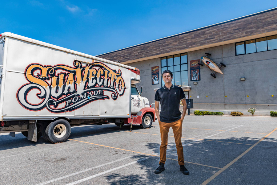 Tony Adame standing in front of the Suavecito building